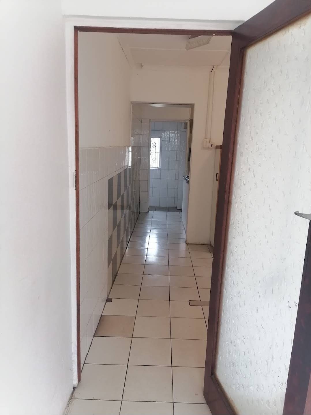 Hallway leading to kitchen